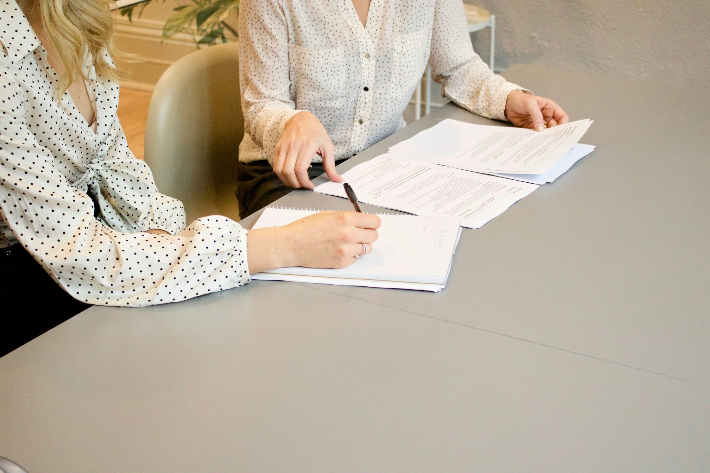 A loan officer reviewing documents with a client
