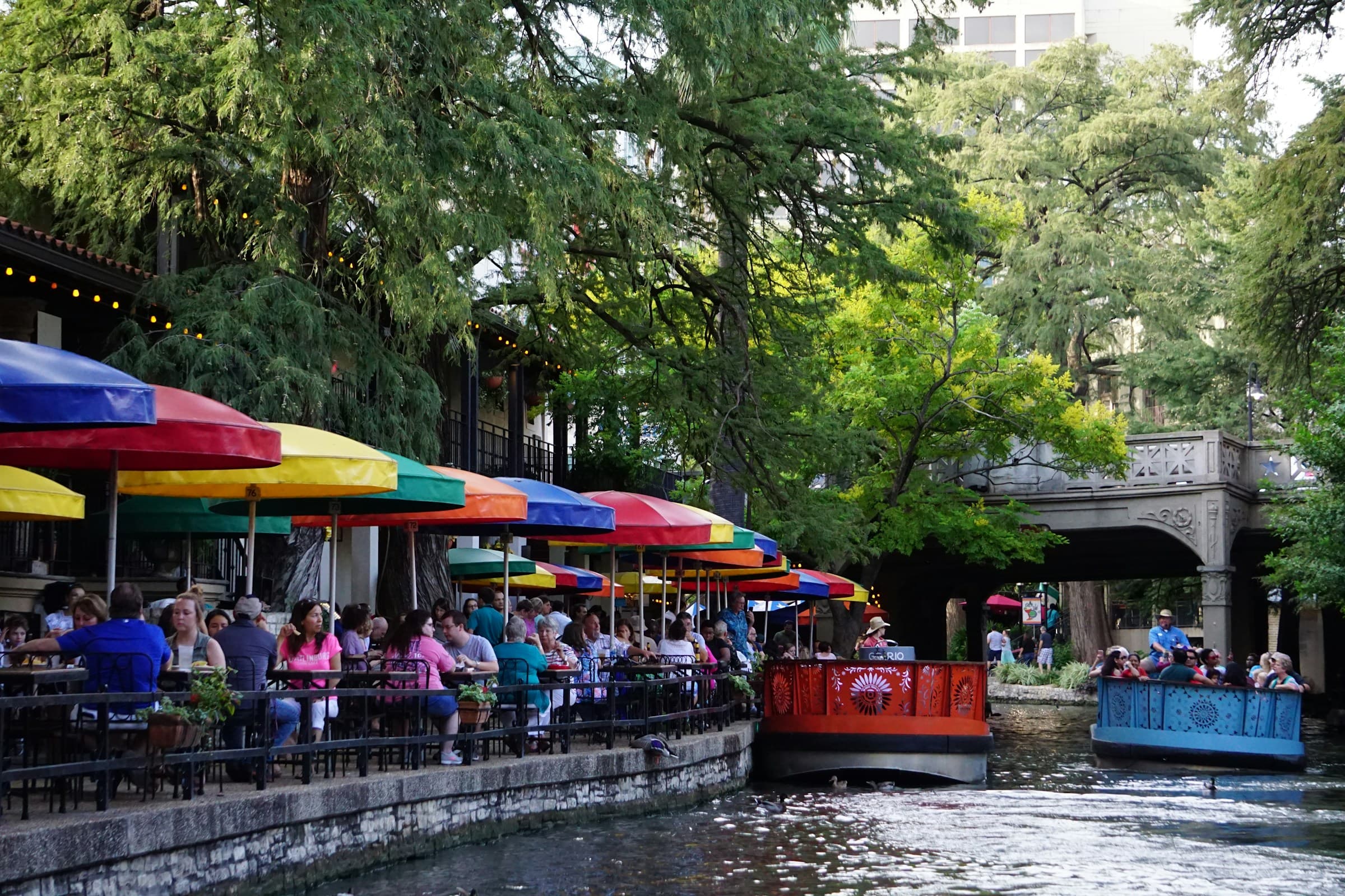 The Tower Life Building over the San Antonio River Walk at dusk